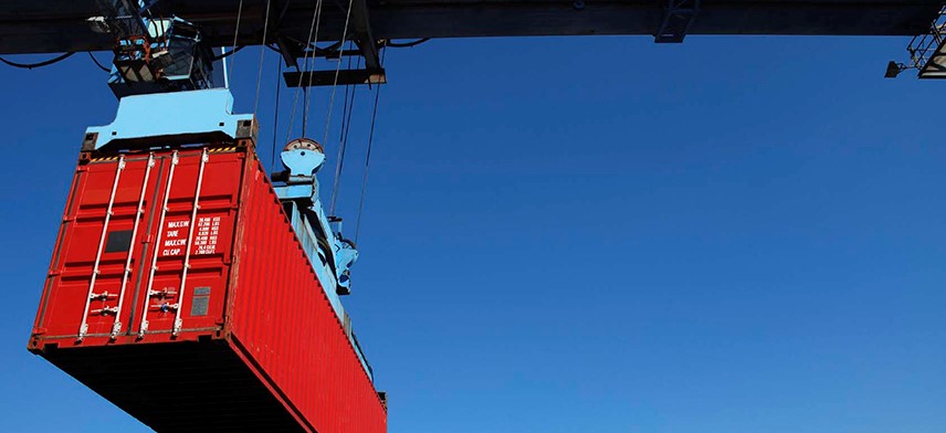shipping container being lifted by crane