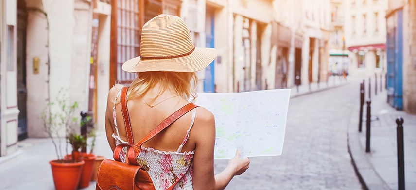 woman reading map while in europe