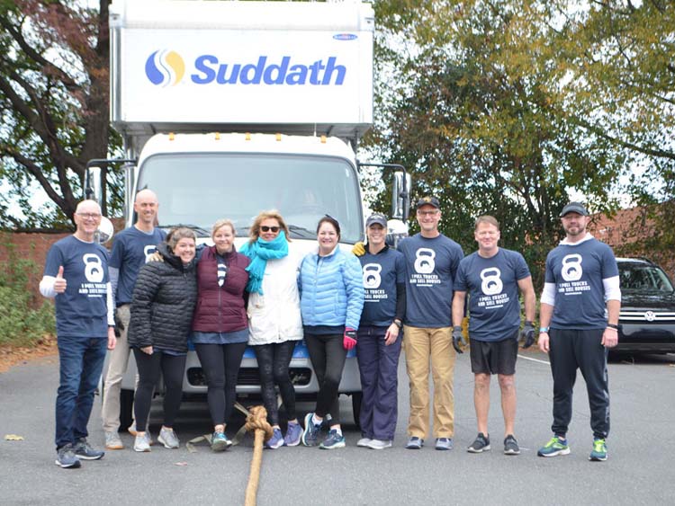 suddath employees in front of moving truck for 2019 charlotte truck pull