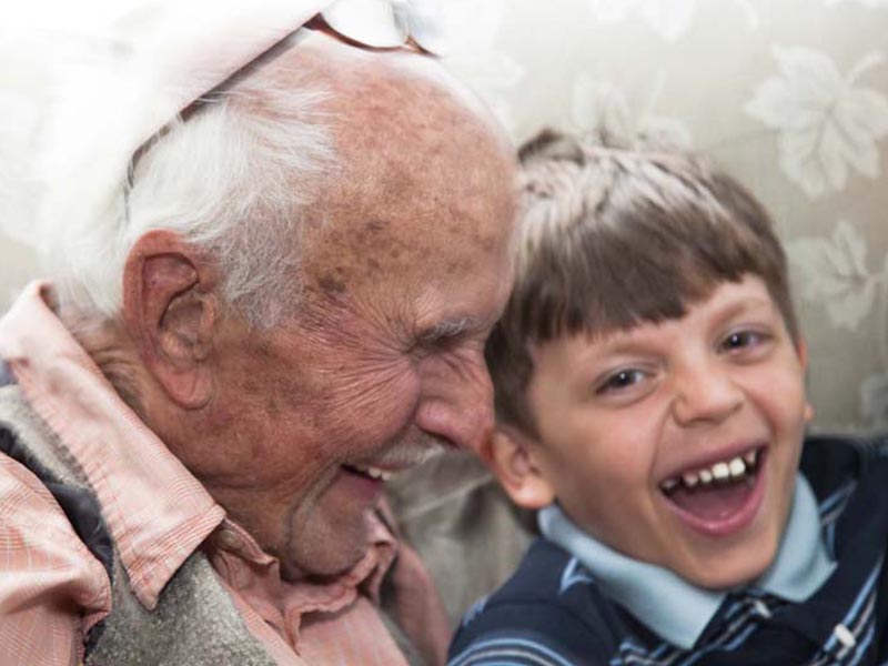 grandfather and grandson laughing