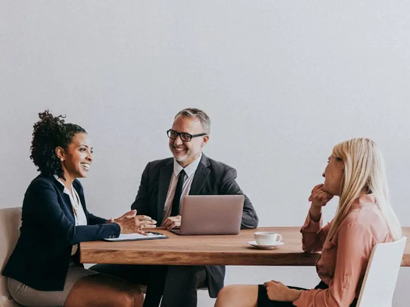 Businesspeople meeting and smiling