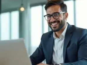 Professional man in suit working on laptop in modern office with city view