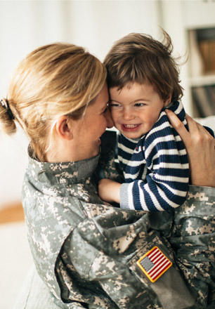 military mom hugging child