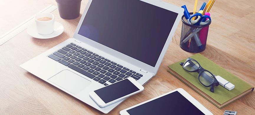 smartphone laptop and tablet on desk