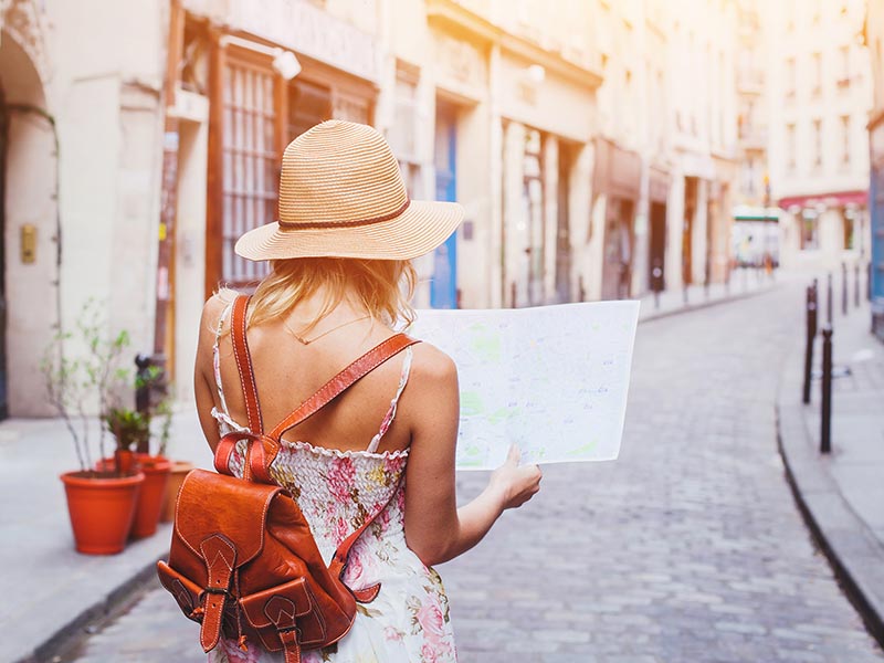woman looking at map after moving abroad to europe